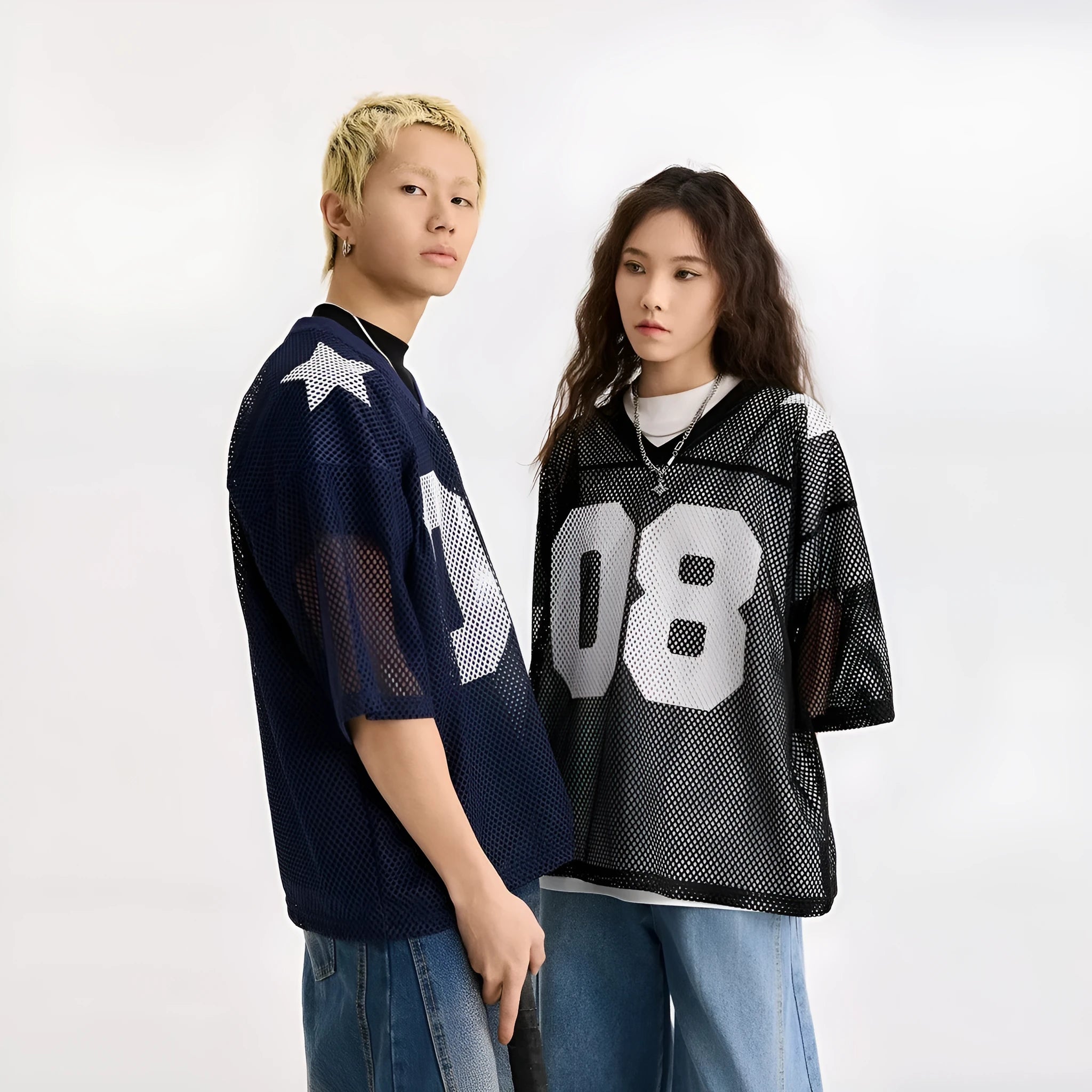 Black loose fit pullover shirt with white letter pattern design, short sleeves.