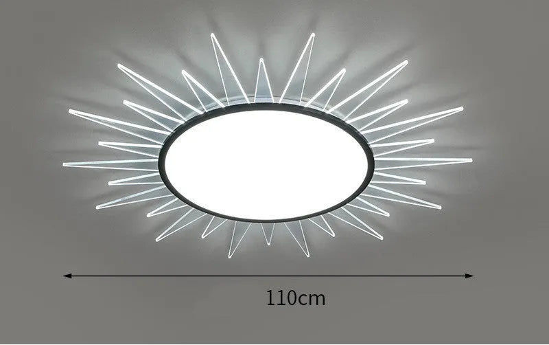 Modern round aluminium LED ceiling lamp with remote control on a white ceiling.