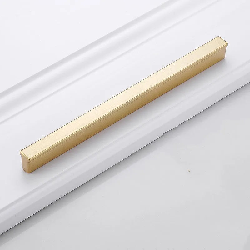 Gold T-shaped aluminium cabinet handle for single hole mounting.