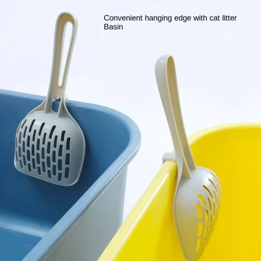 Grey plastic cat litter scoop with self-cleaning base and attached storage bin.