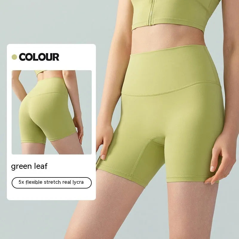 Women's high waist leaf green Lycra yoga shorts for fitness and cycling.