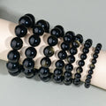 Hand-woven ethnic style unisex obsidian bracelet with round crystal beads.