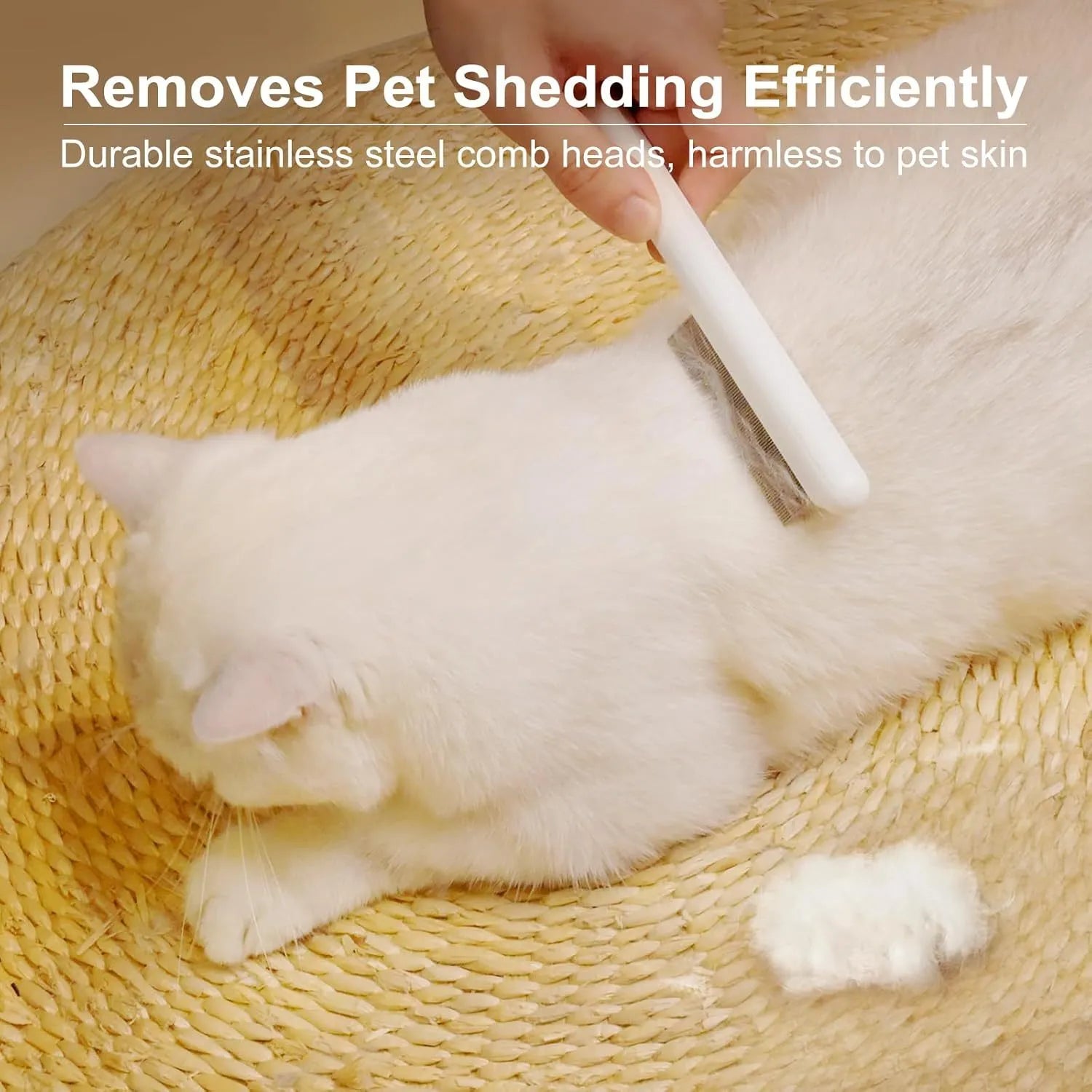 Cat comb with rounded stainless steel teeth and ergonomic handle on white background
