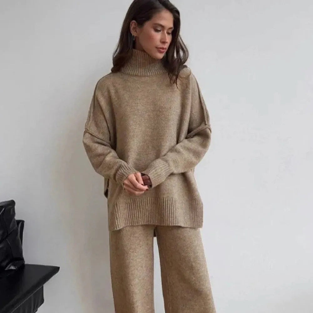 Women's dark grey acrylic sweater with side slits paired with matching trousers