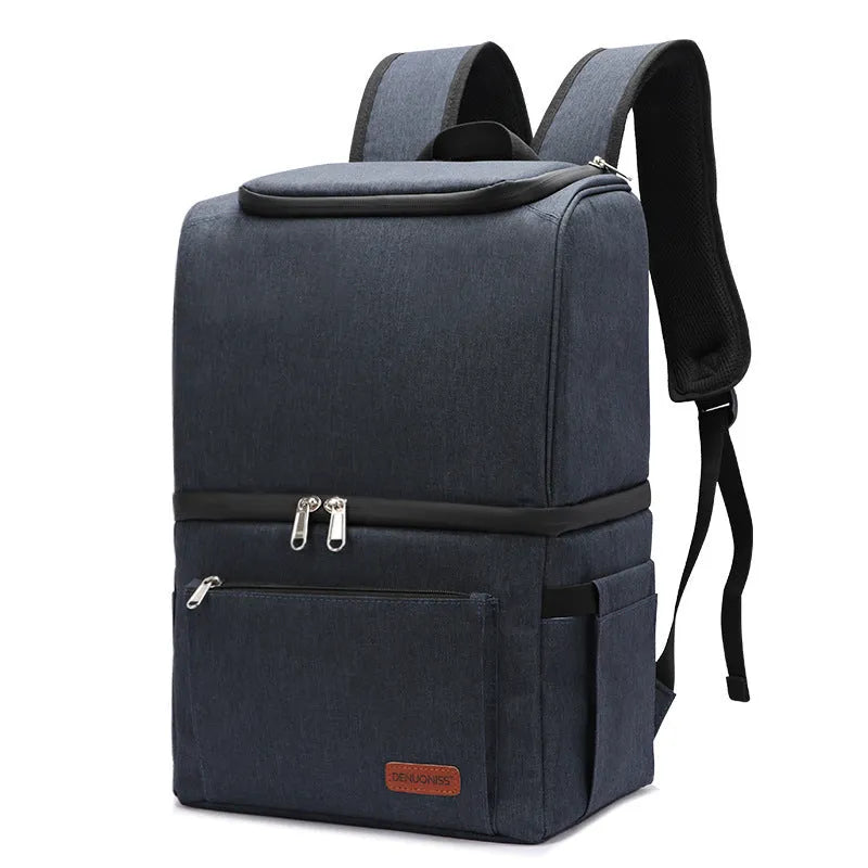 Blue insulated backpack with double-layer construction and refrigerated ice pack compartment open