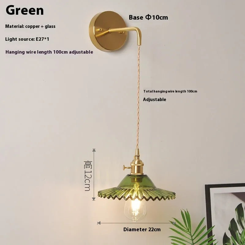 Retro brass lotus wall lamp with a glass shade in a choice of six colours.