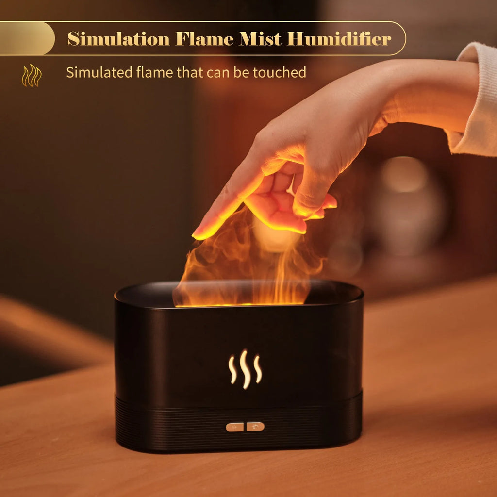 Square 180ml ultrasonic aroma diffuser with flame LED light in black, on a desk with visible mist