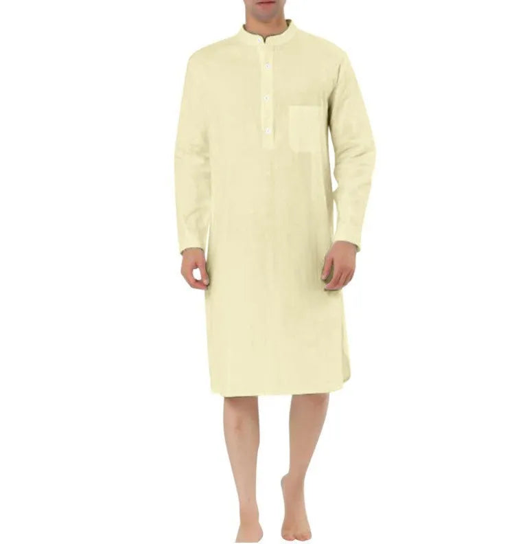 A man's long-sleeve cotton shirt robe in a light blue colour, showing a button front and chest pocket.