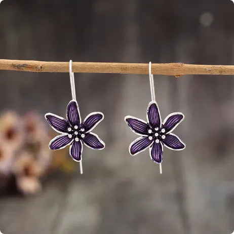 Purple flower-shaped alloy stud earrings with electroplated finish