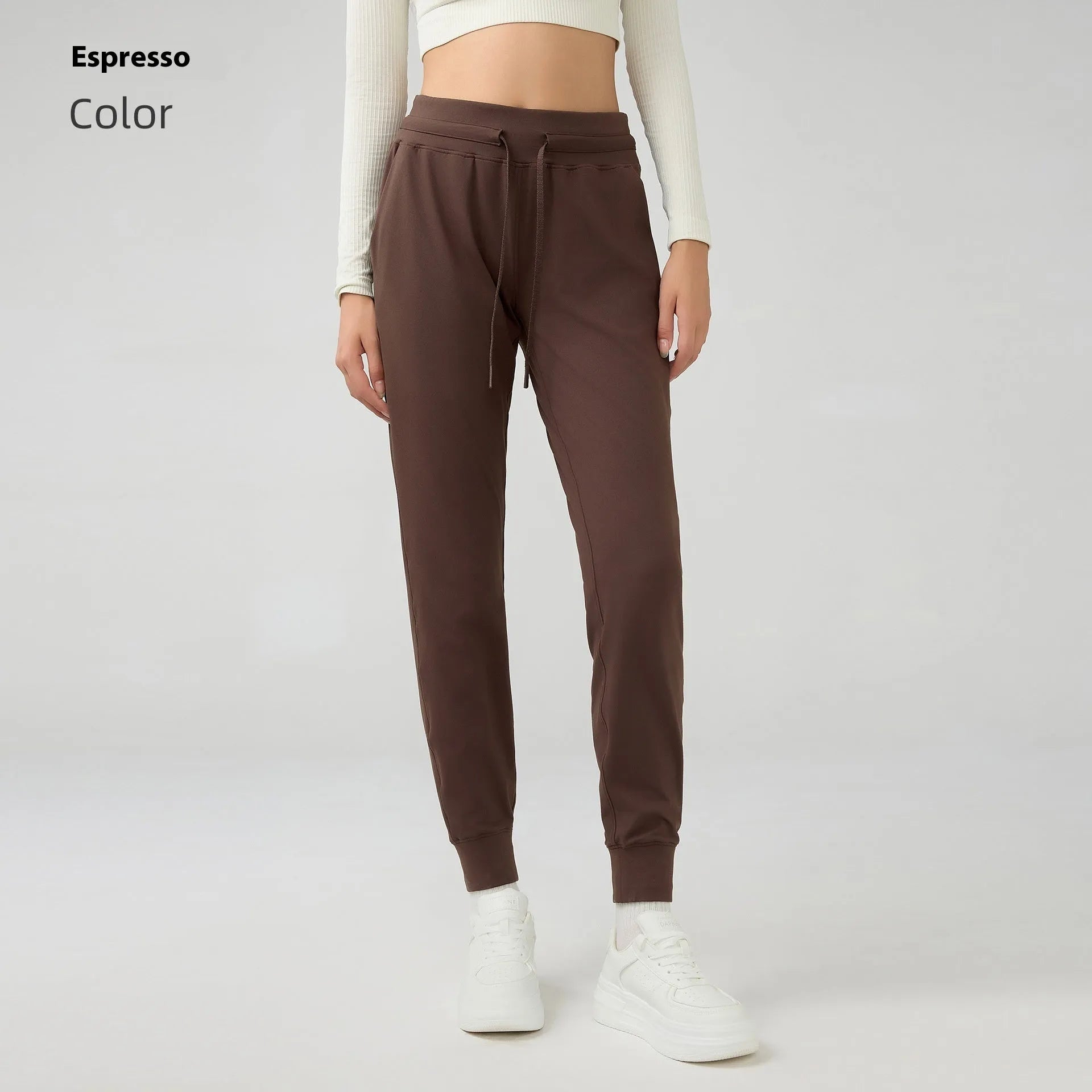 Women's high-waist yoga pants in distilled coffee colour with an elastic drawstring waist for fitness.