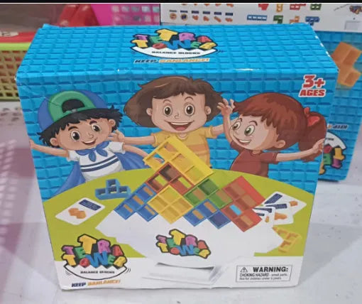 Colourful plastic balance stacking game with blocks, chassis, and base on a table