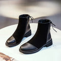 Black women's knee-high Martin boots with side zipper, round toe, and short stout heel.