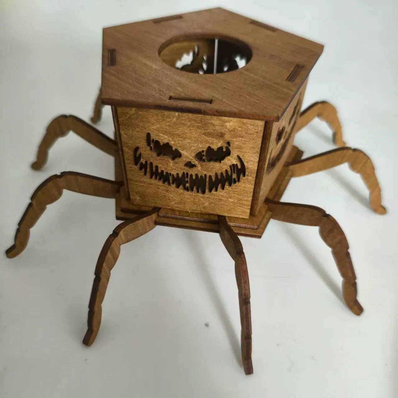 Wooden Halloween candlestick with spider design measuring 21cm by 8.5cm