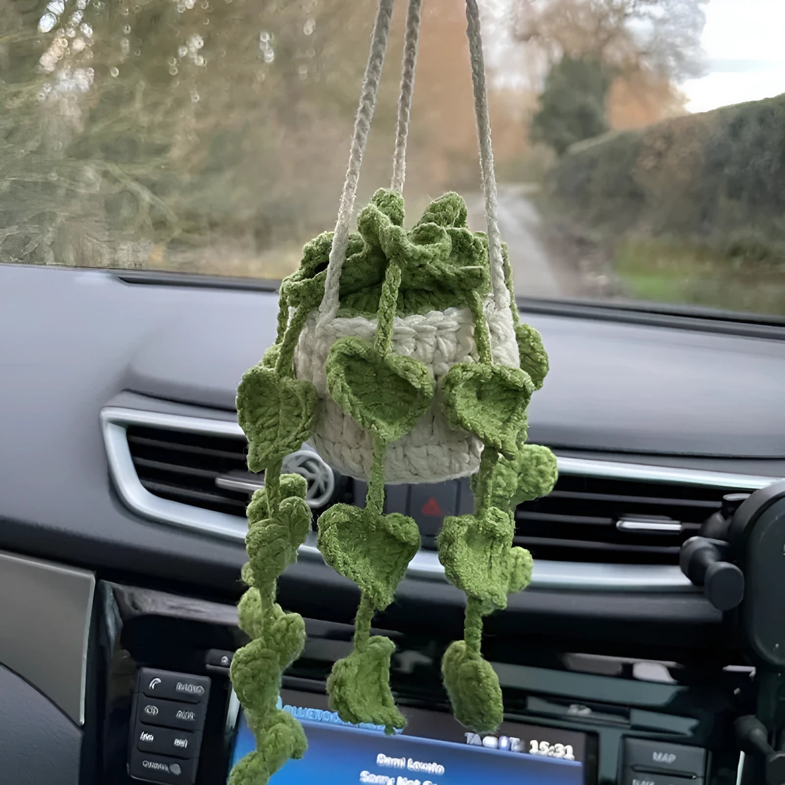 Green and white knitted rope car plant ornament with 8cm base and hanging rope.