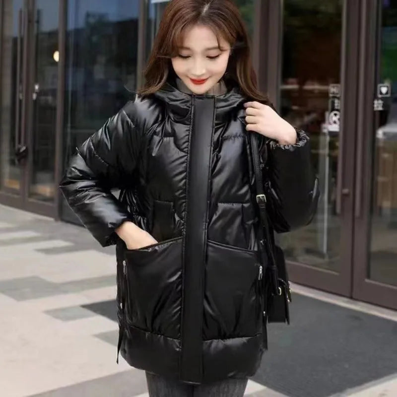 A women's loose-fitting thick hooded winter jacket in an acrylic polyester fabric.