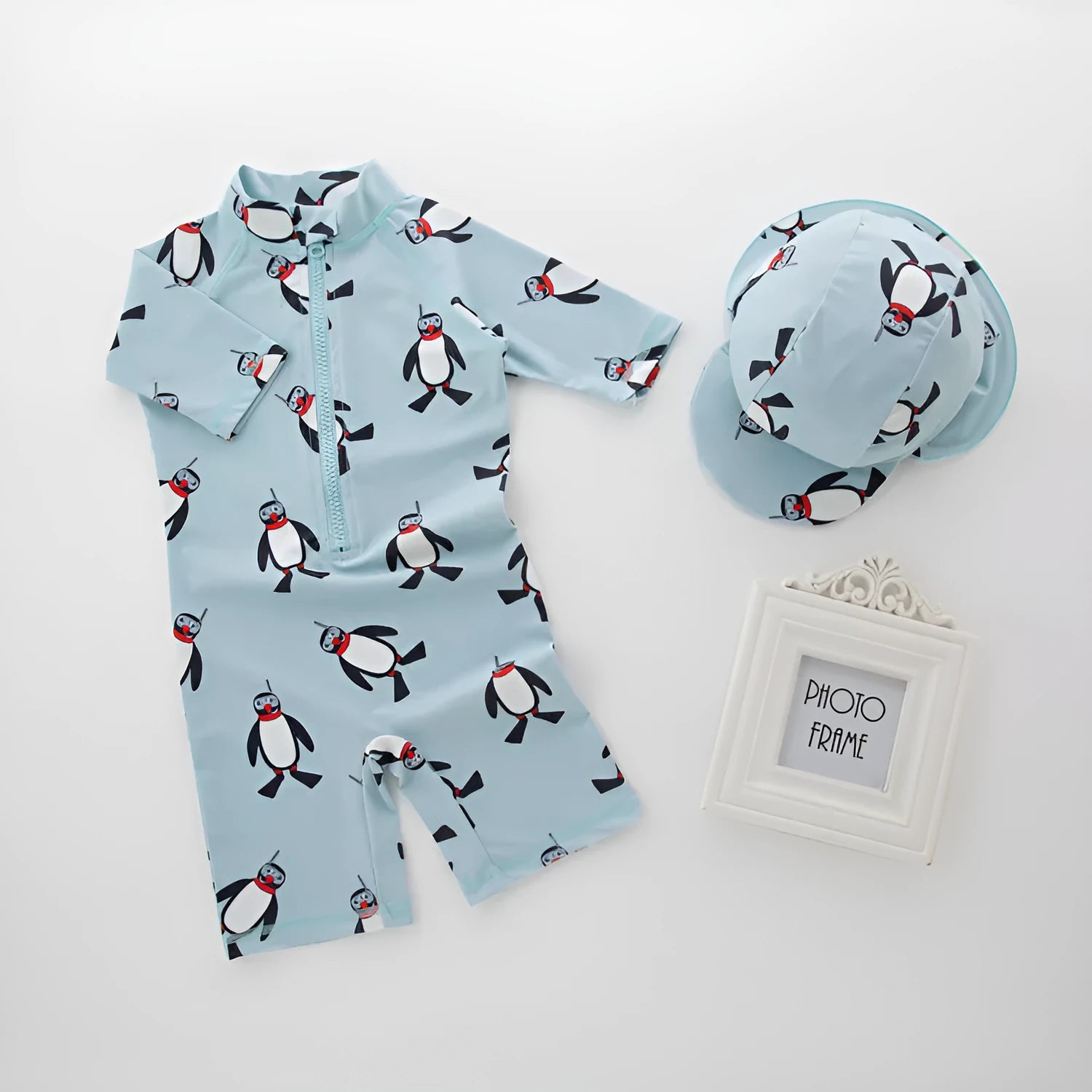 Boys penguin design swimwear set with long sleeves and matching swimming cap