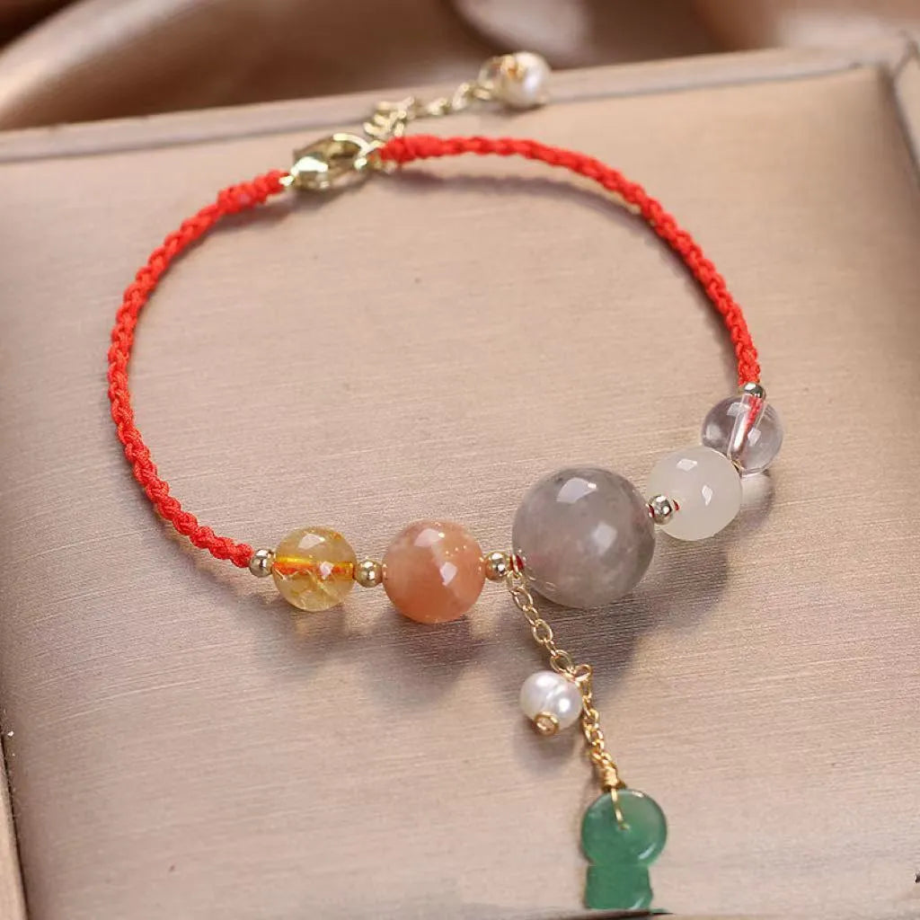 Peace buckle bracelet with crystal sequins on woven wrist string in blue, green, or red