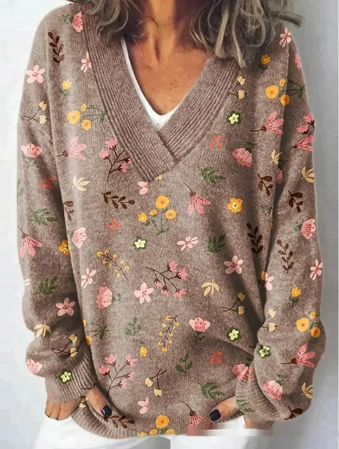 White women's V-neck long sleeve sweatshirt with a detailed 3D floral pattern print.