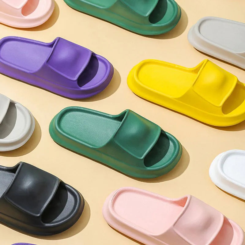 Soft EVA flip-flop slippers with thick sole in multiple colours on a white background.