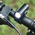 Black USB rechargeable 350 lumen bicycle front light on handlebars