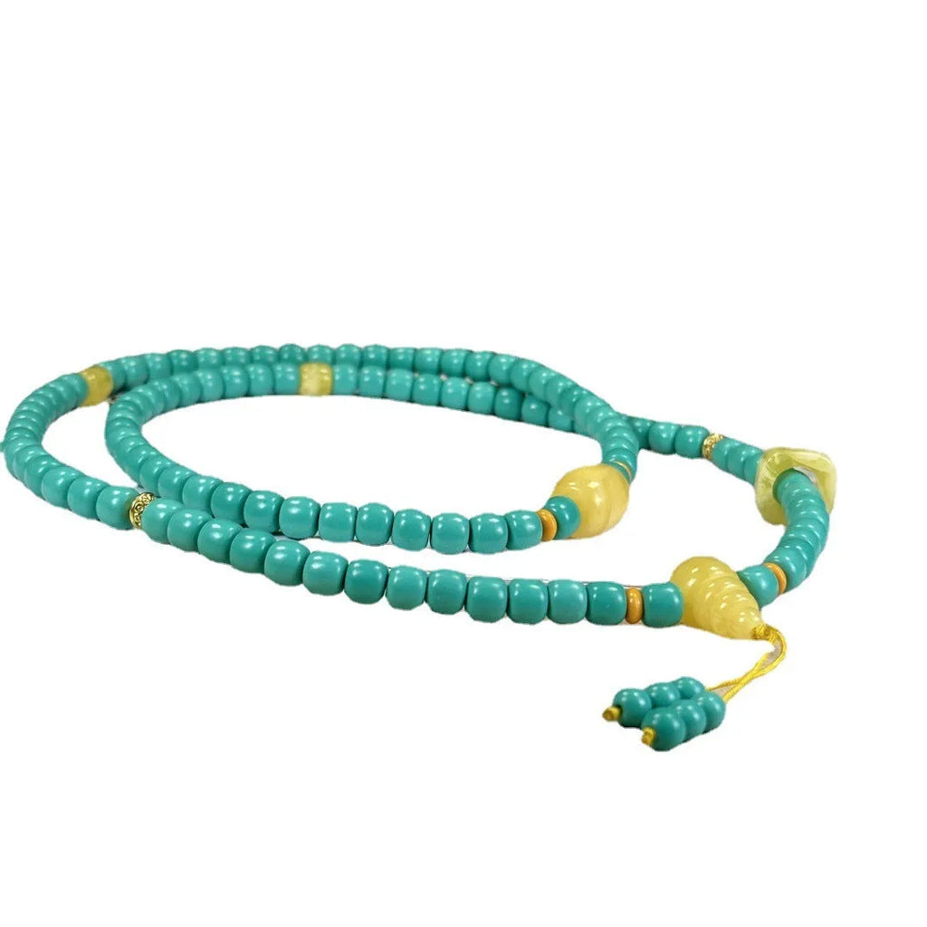 Hand-woven turquoise mesh flower lucky pendant on an adjustable ball bead necklace chain.