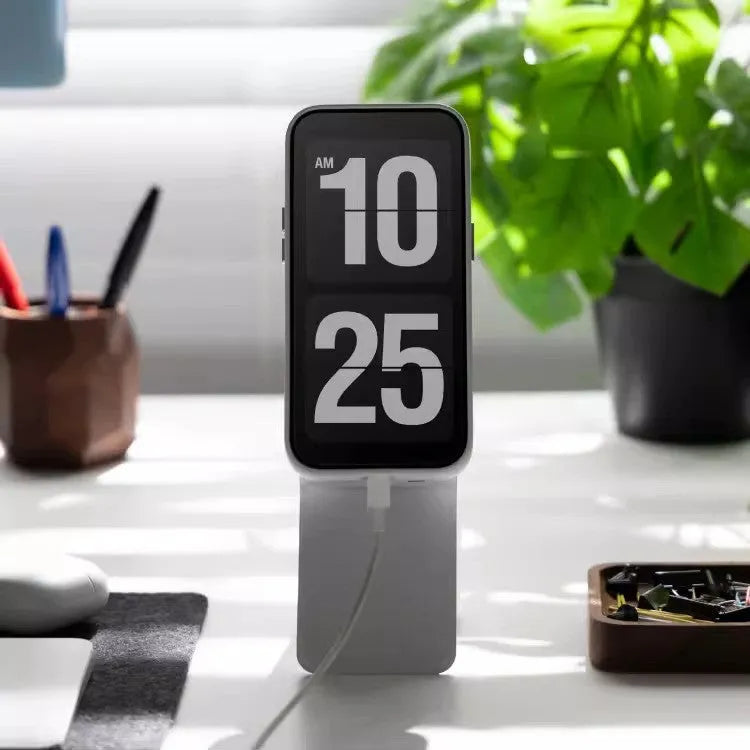 Magnetic mobile phone holder and case in leather with built-in stand, shown in grey.