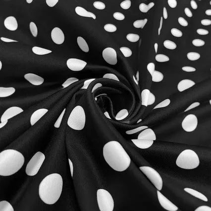 Women's multicolour polka dot pleated dress with square neckline, short sleeves, and front zip.