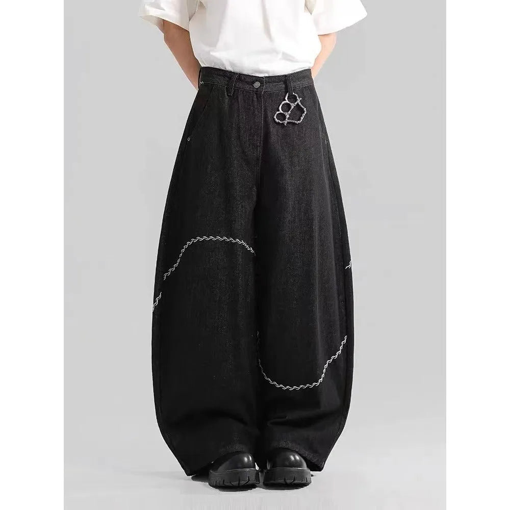 Black straight-leg polyester denim trousers on a hanger, showing mid-waist fit and zip fly.
