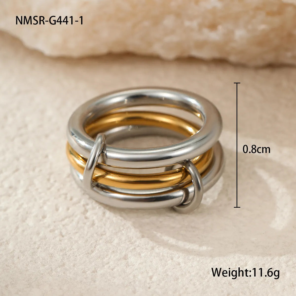 Gold plated exaggerated stackable ring for women on a hand, showing layered jewellery style.