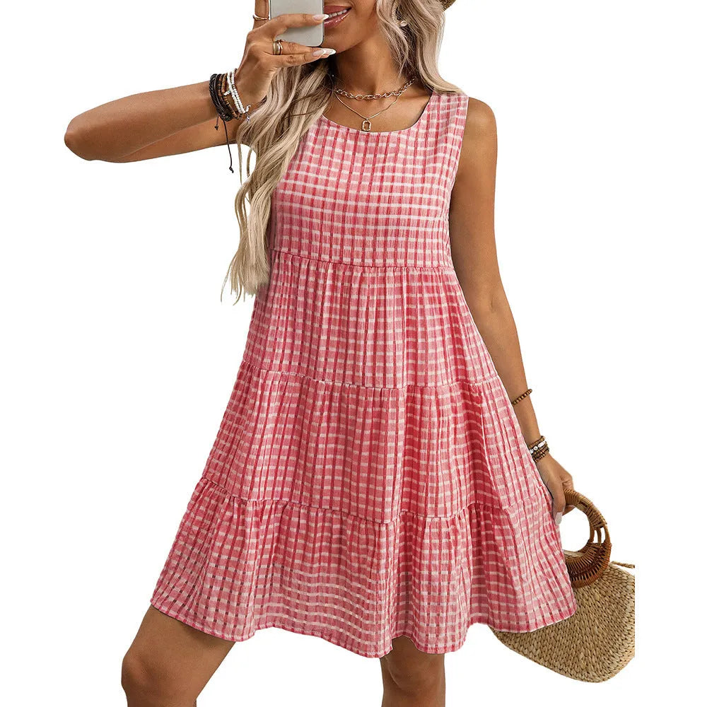 Light blue women's sleeveless plaid dress with high waist and loose swing skirt on a model.