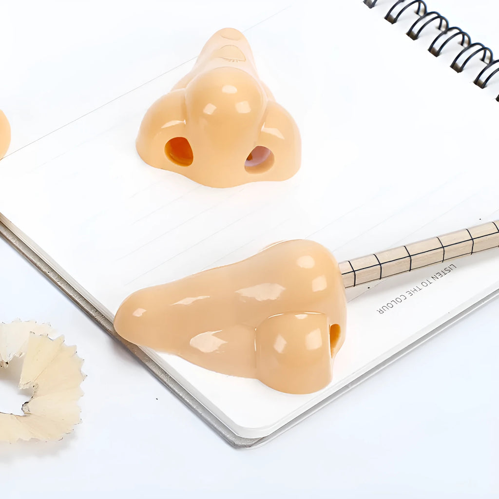 Flesh colour plastic manual pencil sharpener with large shaving container measuring 58x45x30mm