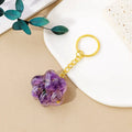Natural crystal cat's paw keychain pendant in assorted gemstone colours on a keyring.