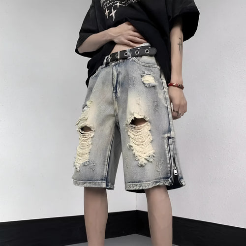 Blue retro tattered denim shorts with a wide leg and loose fit on a hanger.