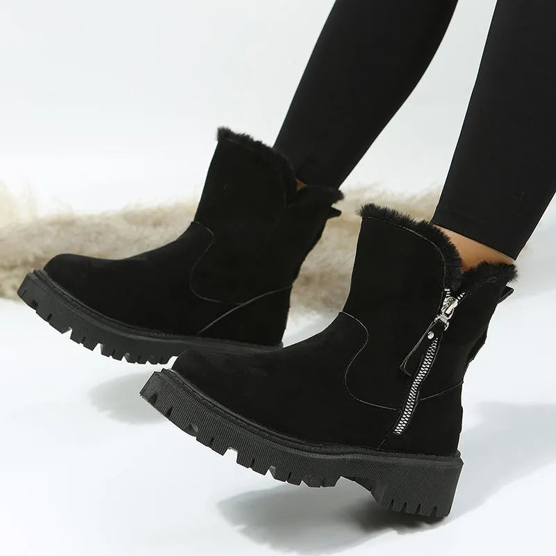 Women's black high-top snow boots with a side zipper and faux suede upper on a rubber sole.