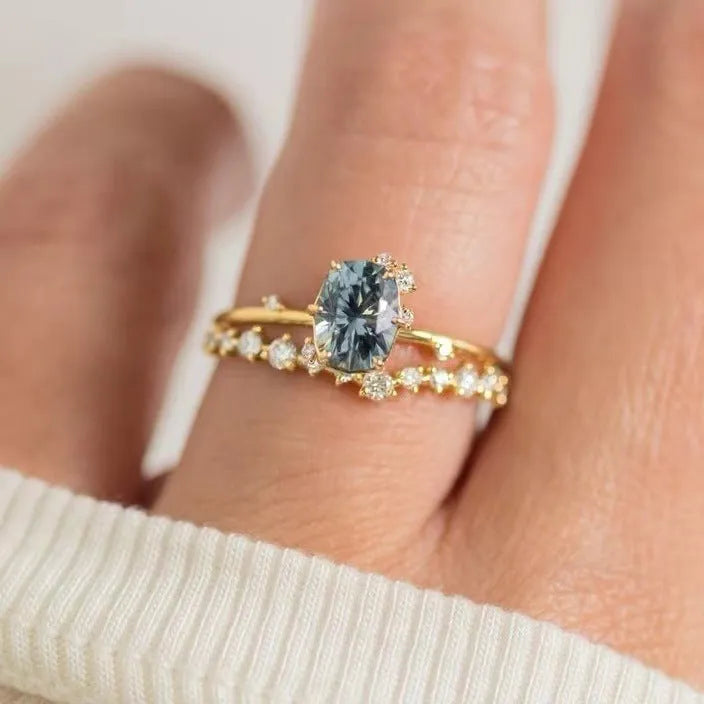 Gold plated floral women's ring with green zircon stone inlay on model finger