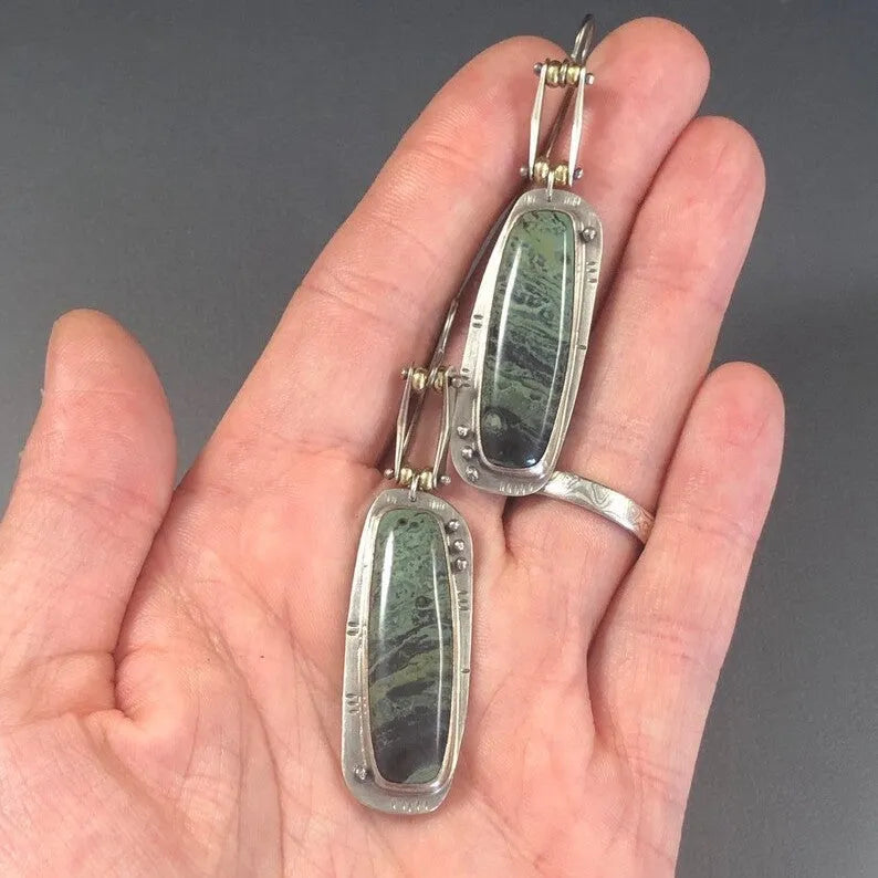 Geometric circular alloy earrings with grey and white marble pattern measuring 20mm diameter