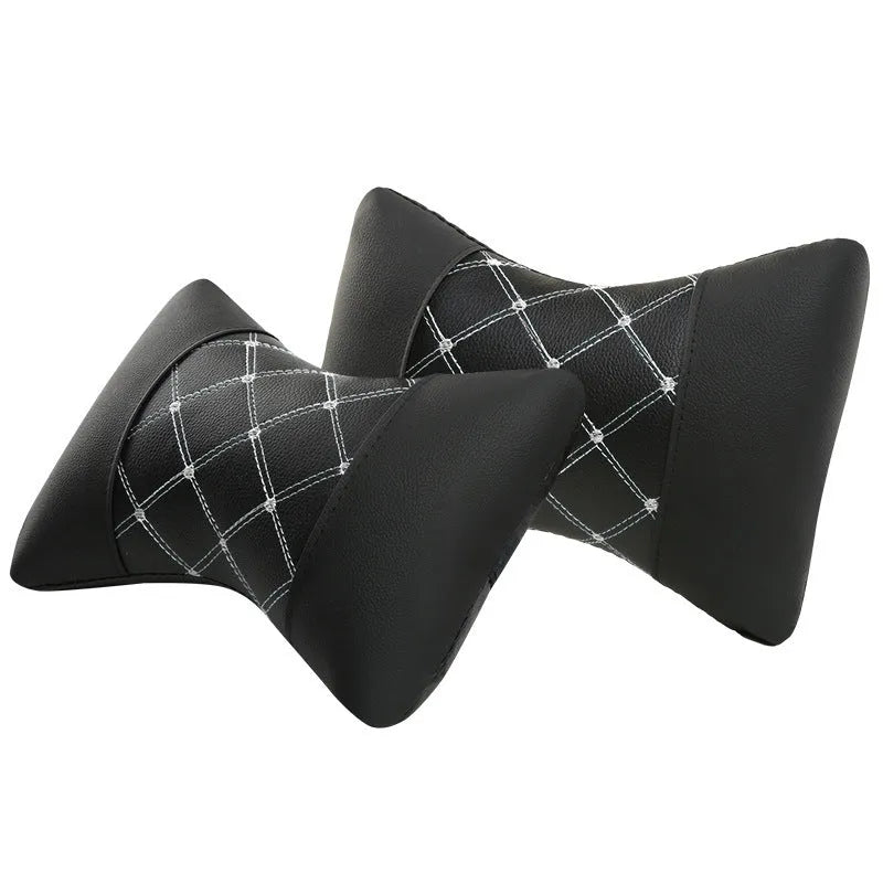 Black leather quilted car headrest pillow for neck support with diamond pattern stitching.