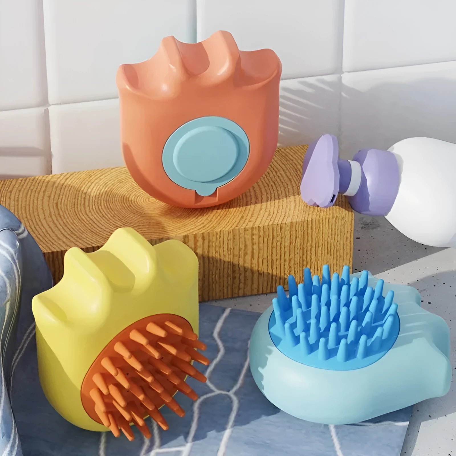 Blue pet bath brush with massage comb bristles and a built-in shampoo box.