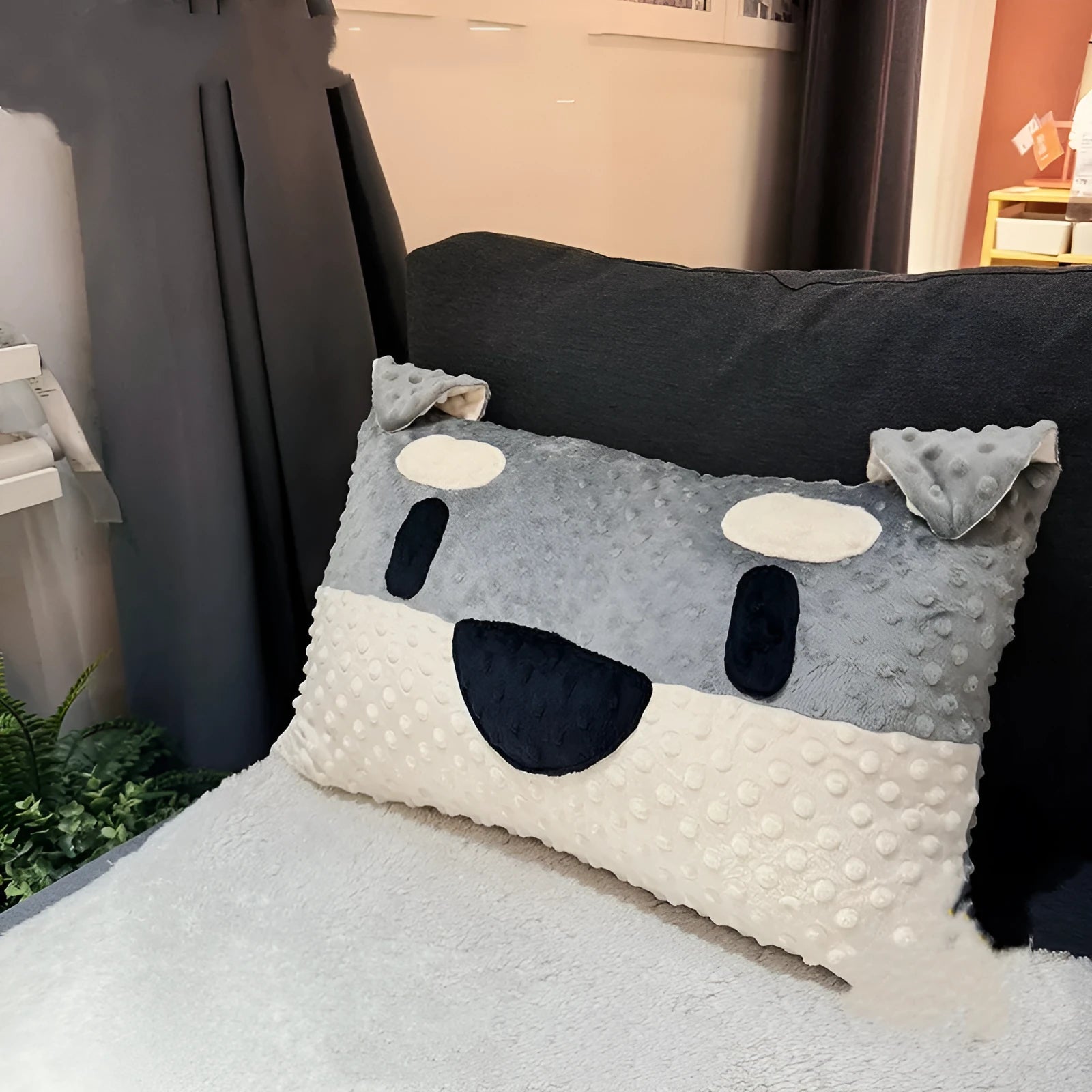 Grey Schnauzer or white West Highland Terrier themed pet pillow cushion on a sofa