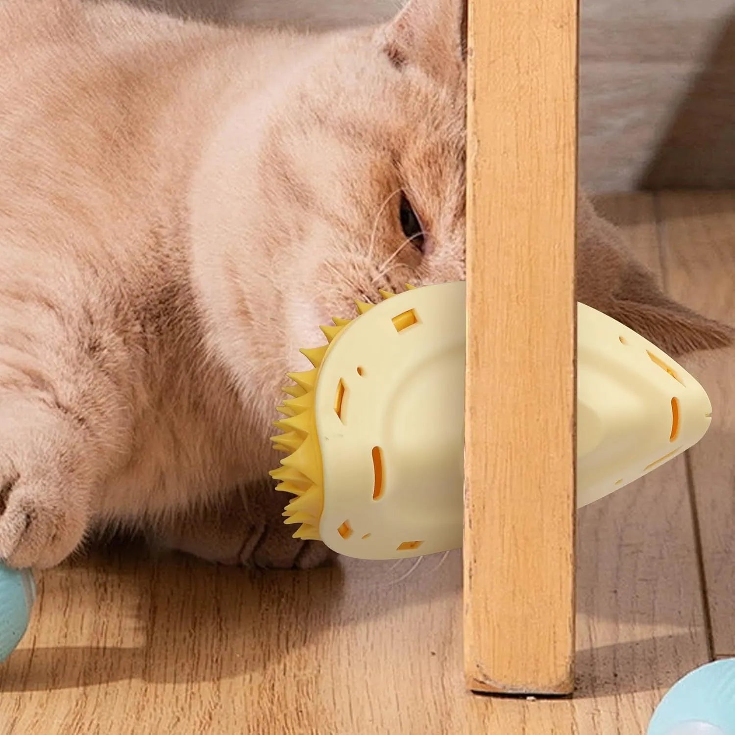 Yellow durian-shaped cat corner scratcher with massage comb surface mounted on wall