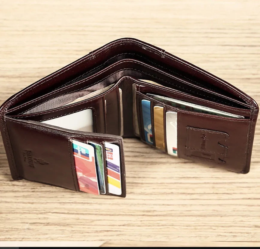 Men's genuine leather wallet open showing multiple internal compartments including card slots and secret pocket