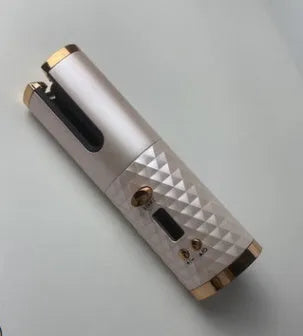 White portable automatic curling iron with USB charging cable and gold ceramic curling barrel.