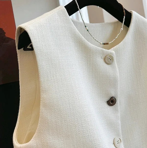 Women's round neck sleeveless vest in polyester with French bandage style, shown in milky white and black colours