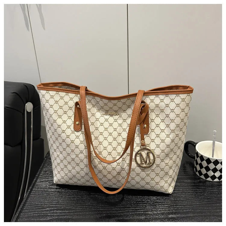 Street trend western style shoulder bag in PU material with sewn detailing, shown in black.