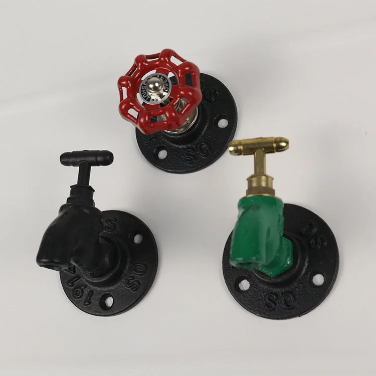 Water pipe style polished metal wall hook for hanging towels and clothes in a choice of three colours.