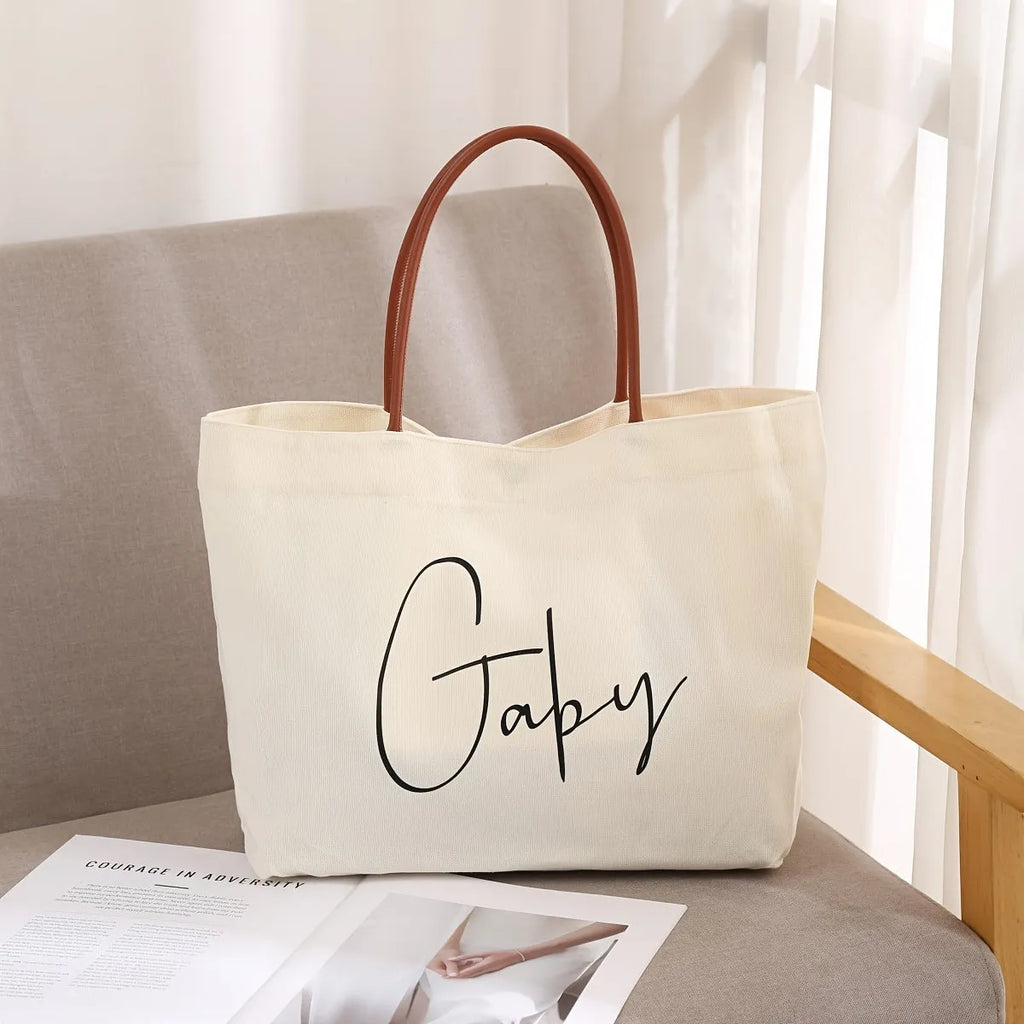Large natural cotton canvas tote bag with wide straps, shown in beige white colour.