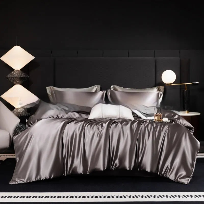 Silk bed sheet four-piece set in solid colour folded, showing options for Ash Purple, Cool Black, and Golden Camel.