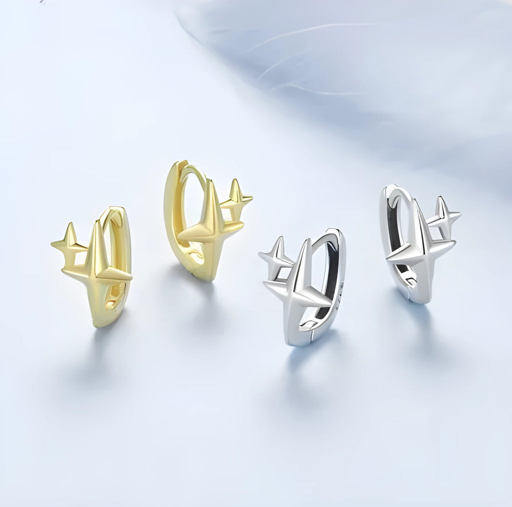 Minimalist oxidised sterling silver star clip earring with a single cubic zirconia stone.