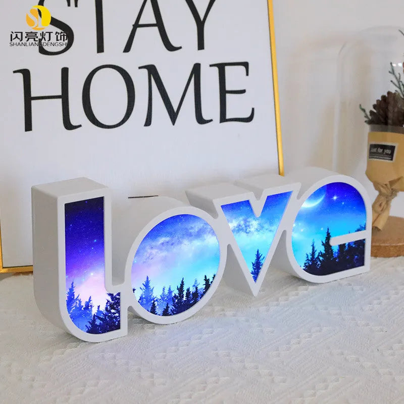 Colourful LED love light decorative lamp with plastic shell on a table