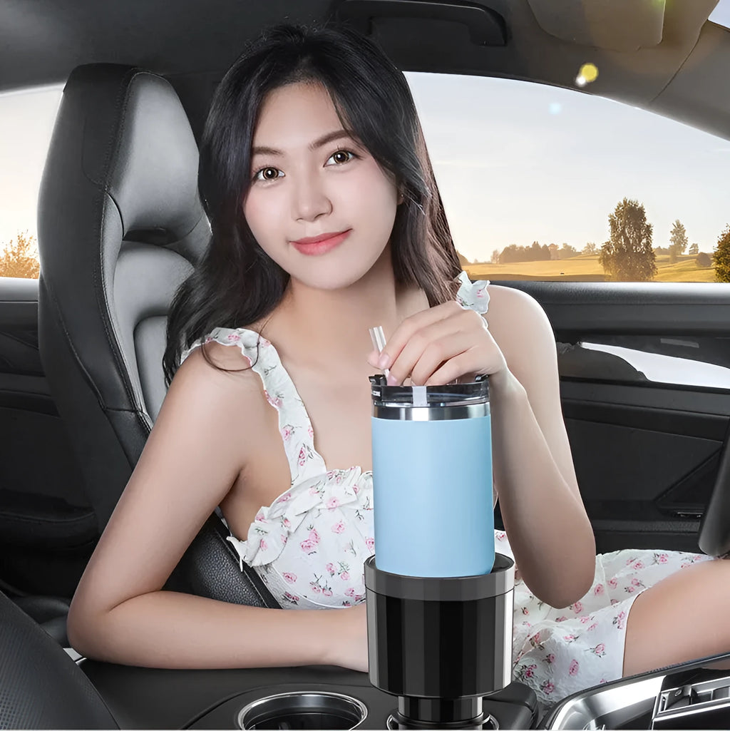 Matte black car cup holder expander with adjustable base for large bottles and cups.